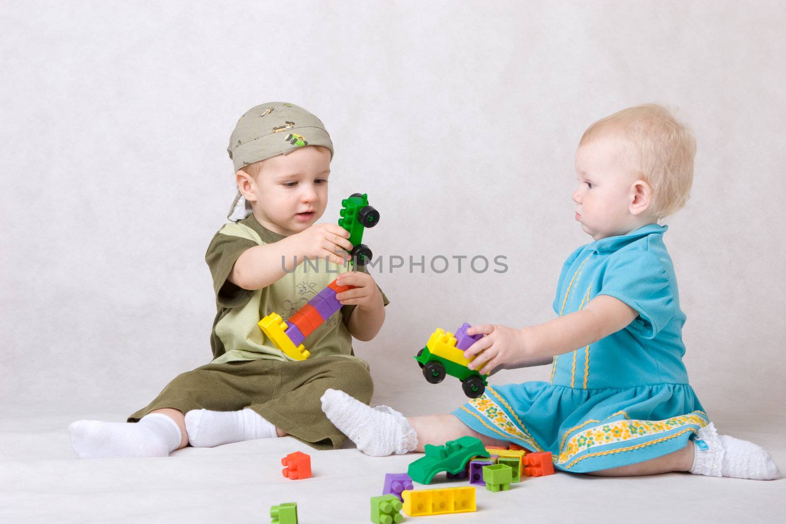 a boy and a girl of one and a half years old play the designer c by vsurkov