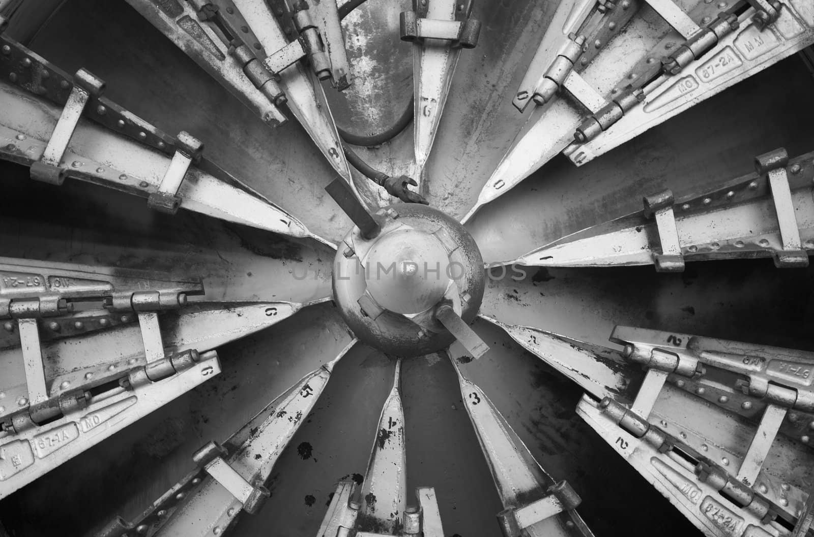 Rotary auger on the front of a locomotive used for removing snow from train tracks.