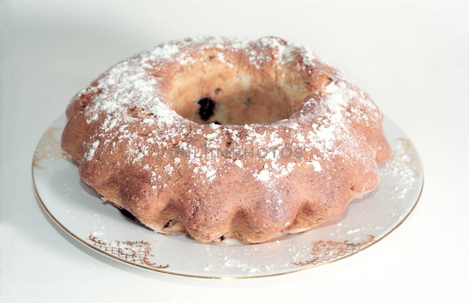 Easter cake on the plate with powdered sugar