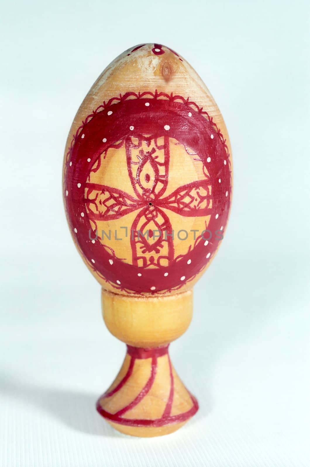 Easter egg of wood with red cross  by mulden