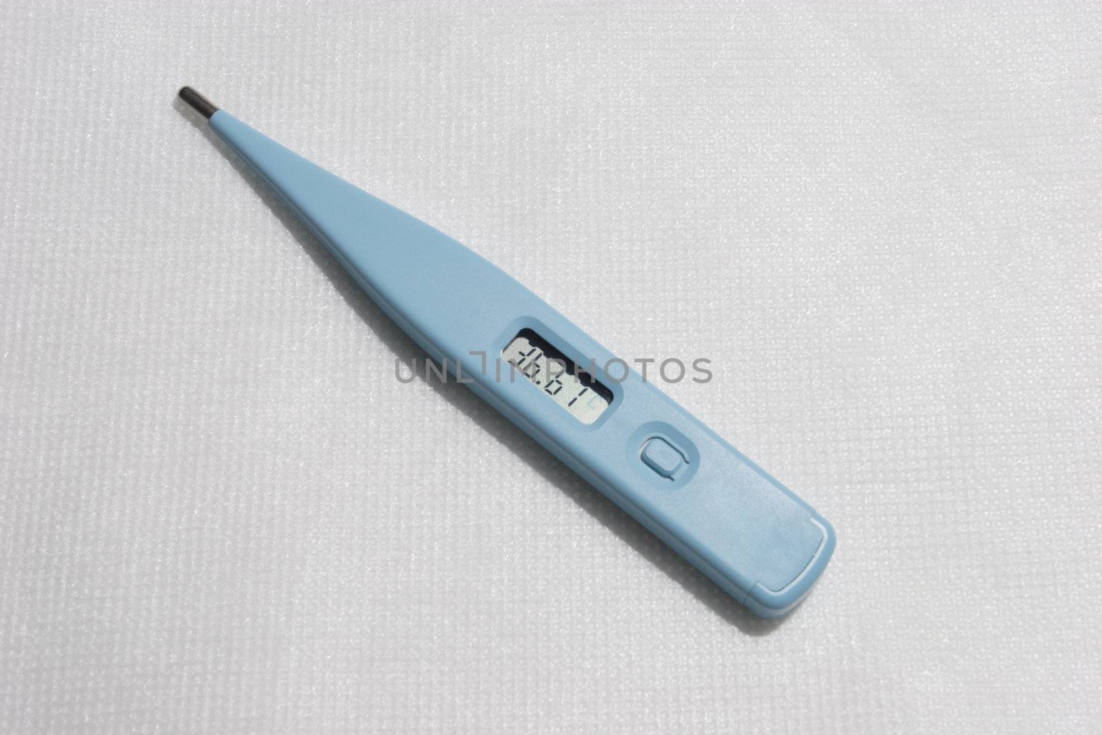 electronic thermometer shows temperature 36,6 