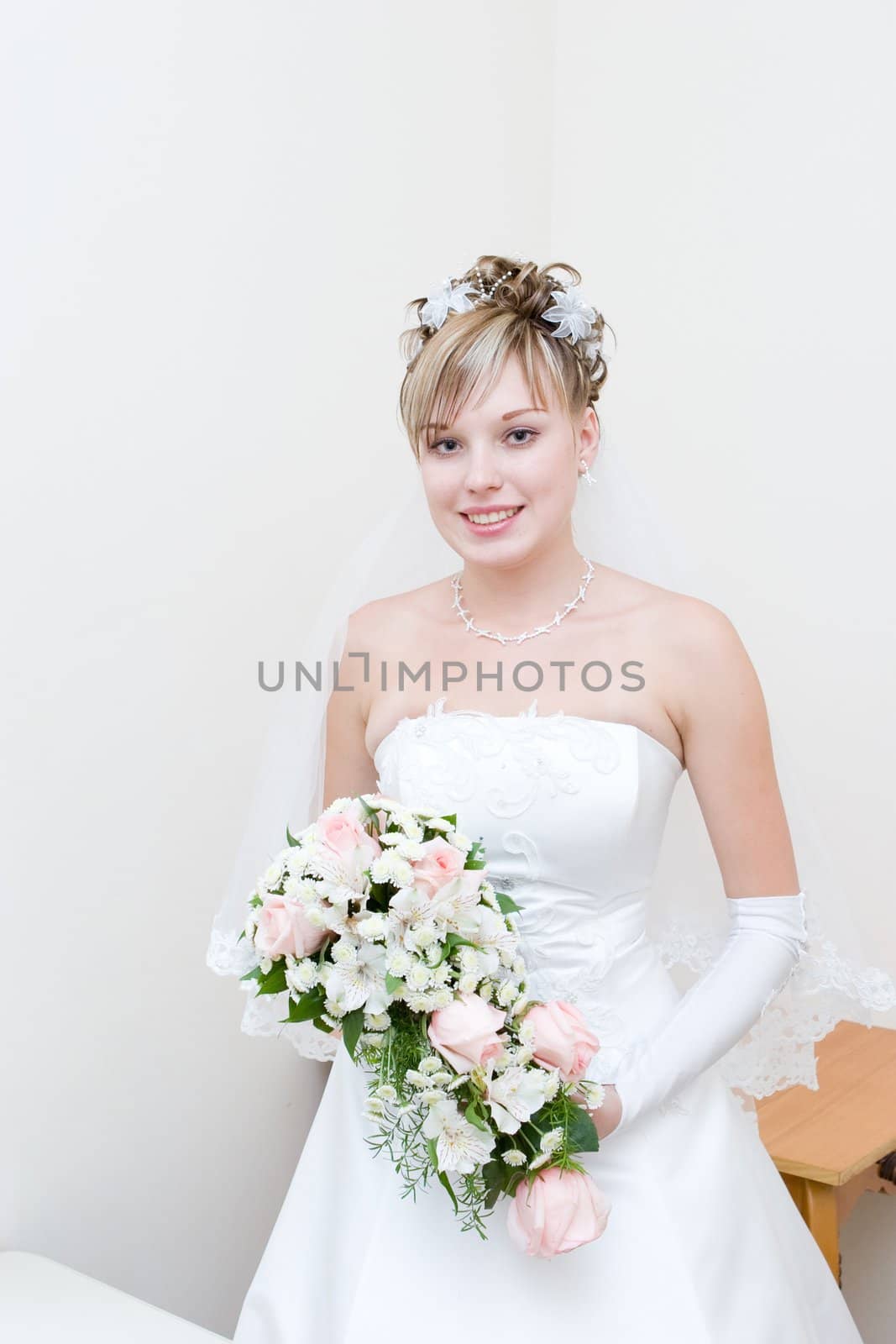 a beautiful happy bride with a flower bouquet