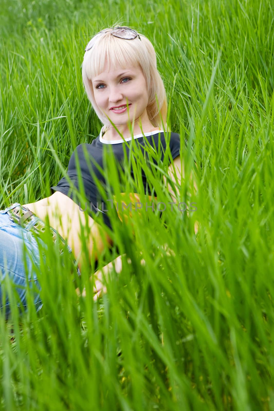young girl rest in the green meadow