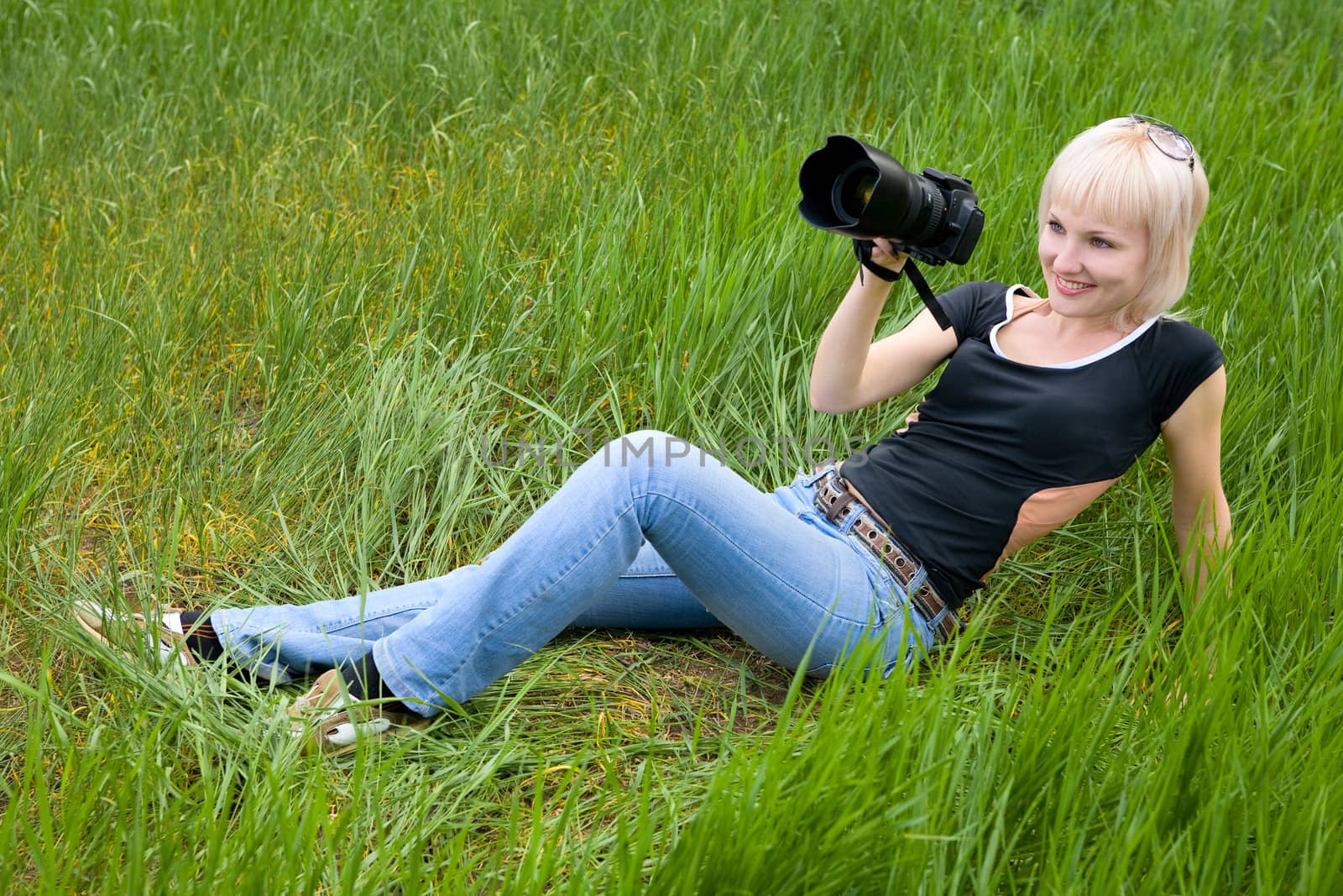 pretty blond girl with photo camera