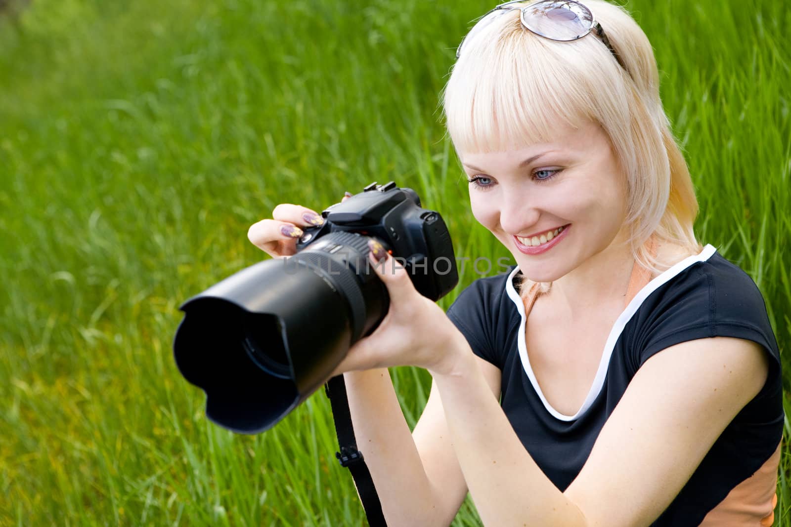 blond girl with photo camera