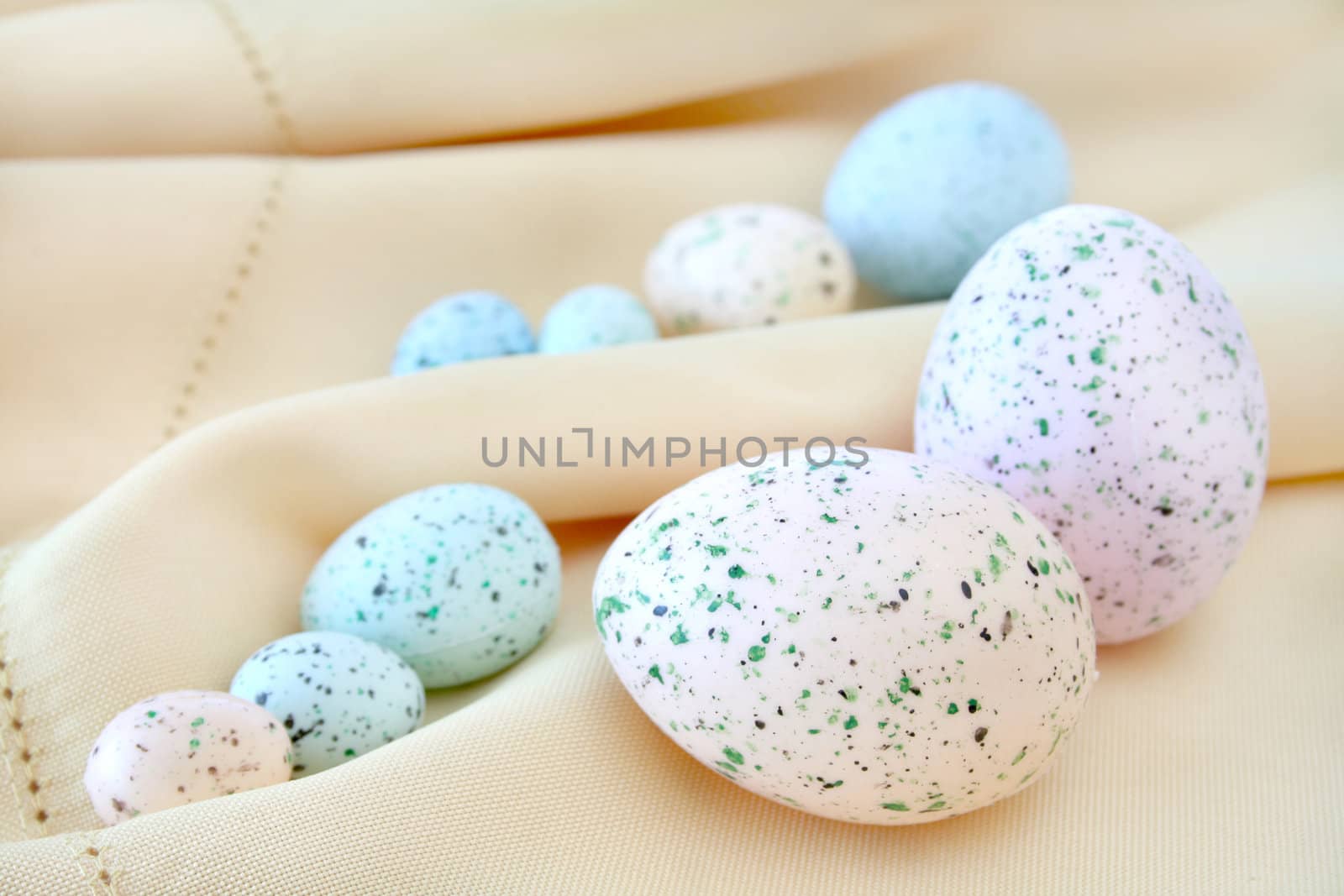 Colorful Easter eggs on a cloth background.