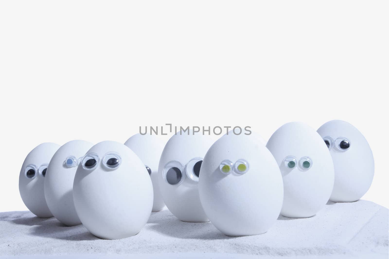 Eggs with eyeballs, lined up in row, Egg people. Add your own expressions