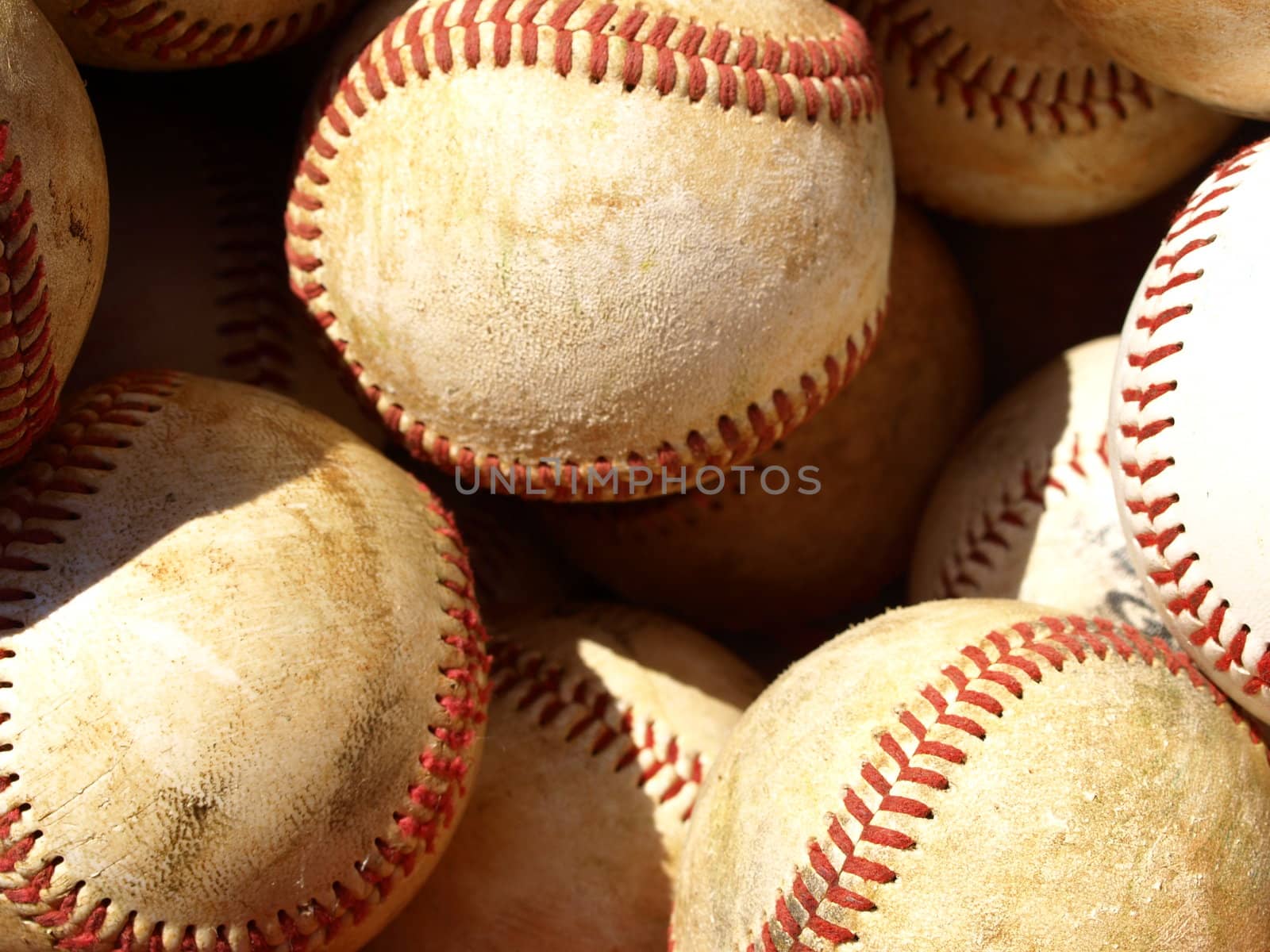 bucket of old baseballs ready for practice