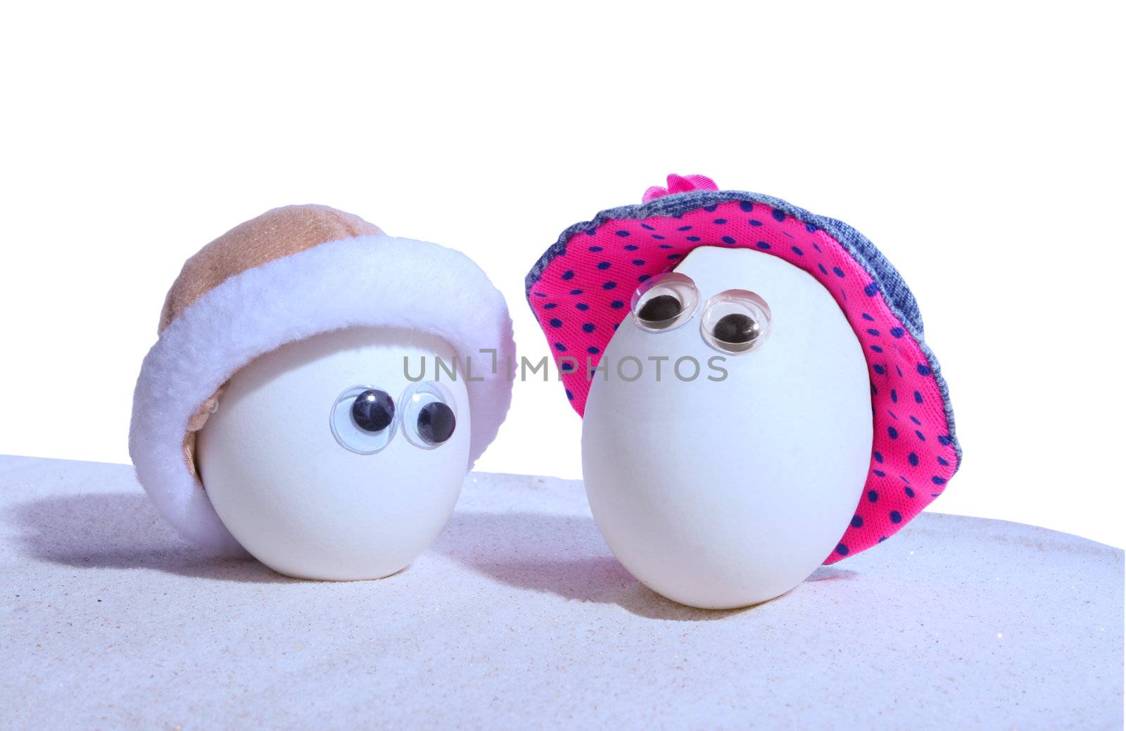 Two hardboiled eggs with eyeballs and hats, add your own expressions,