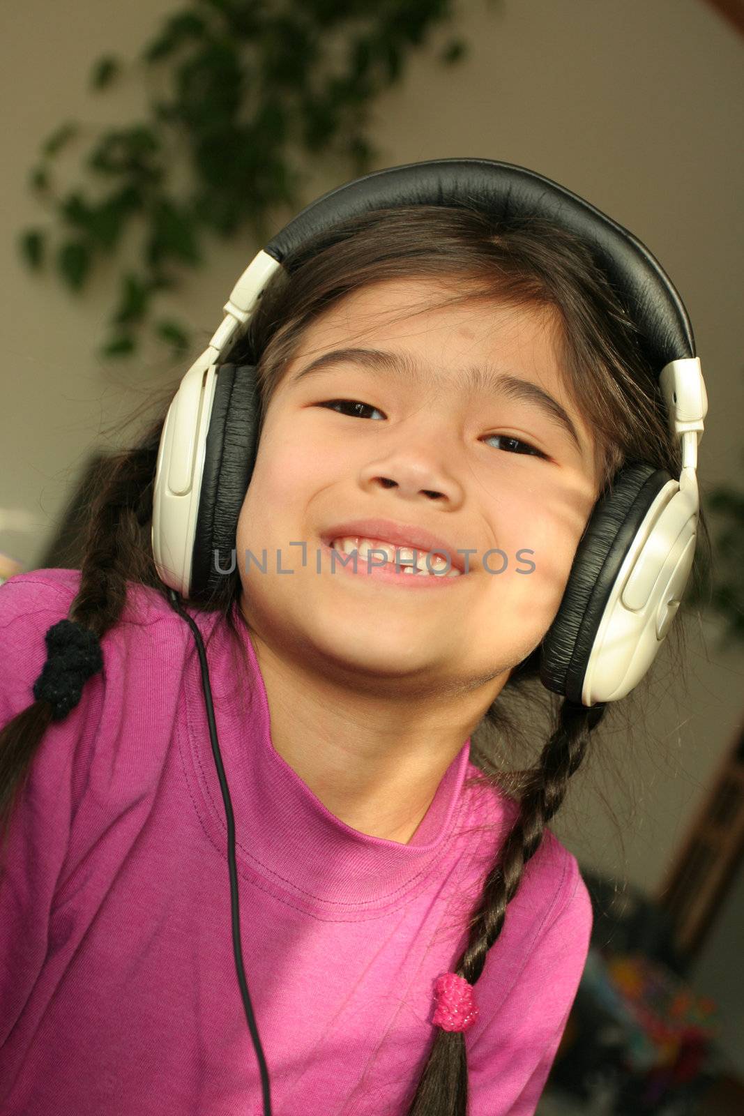 Six year old listening to music with headphones