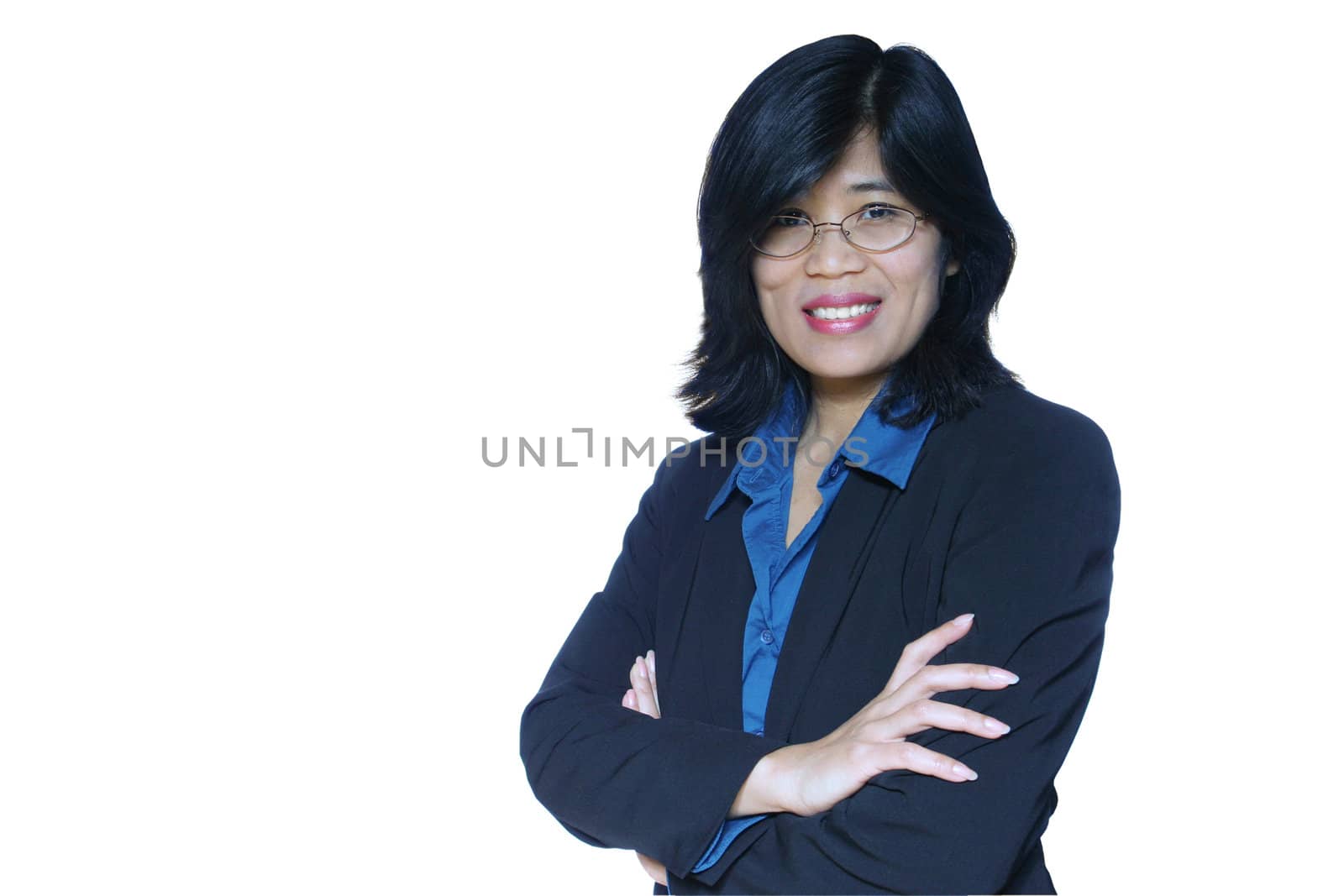 Smiling asian business woman in black suit, arms crossed.