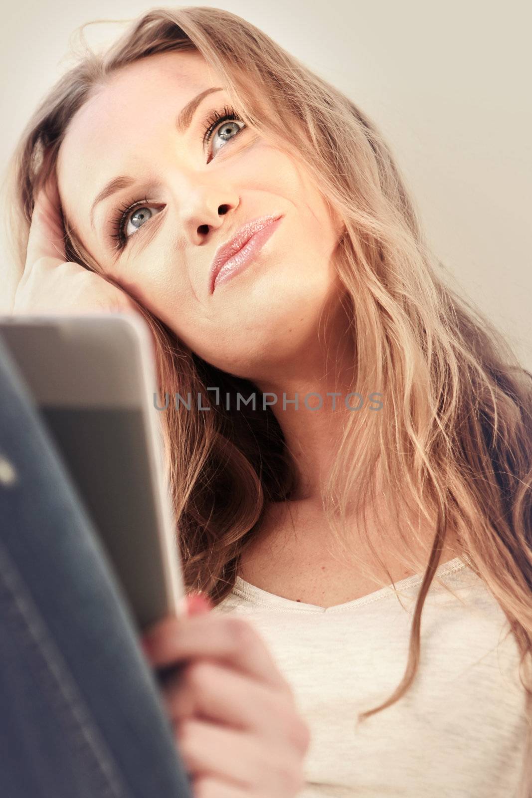 Beautiful girl reading e-book by robert_przybysz