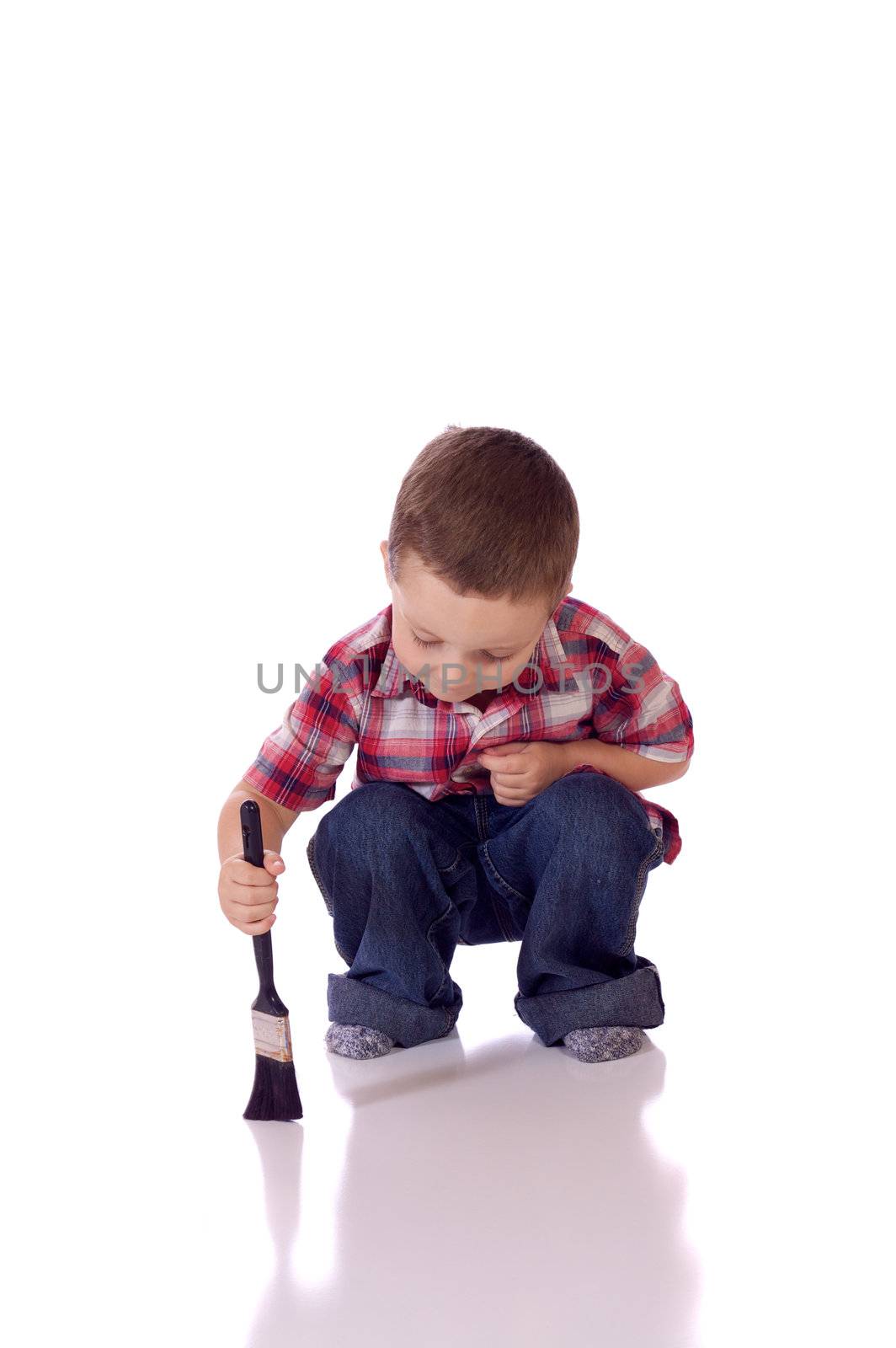 Cute little boy with a brush