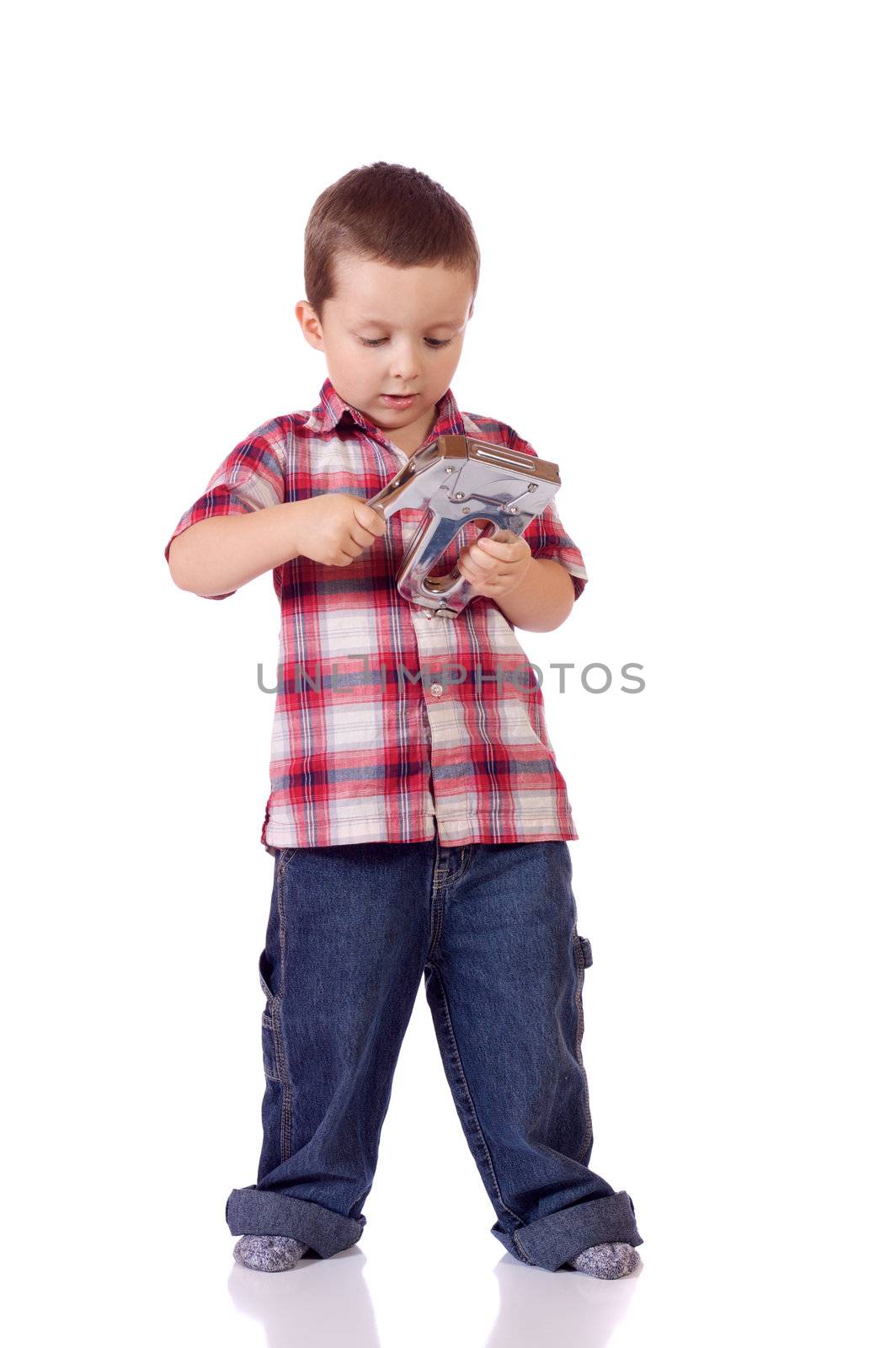 Cute little boy with a stapler