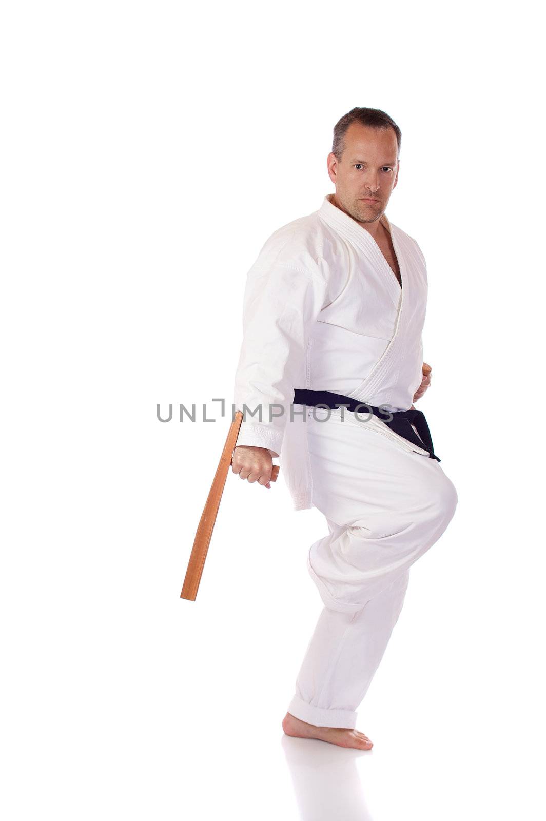 Man in karate-gi with two tonfa in his hands