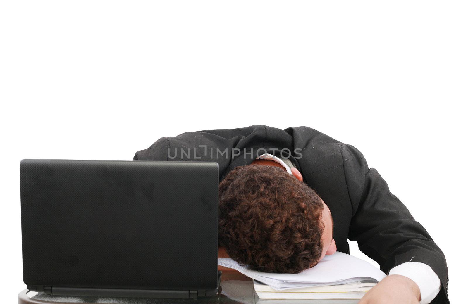young business man sleeping on the laptop
