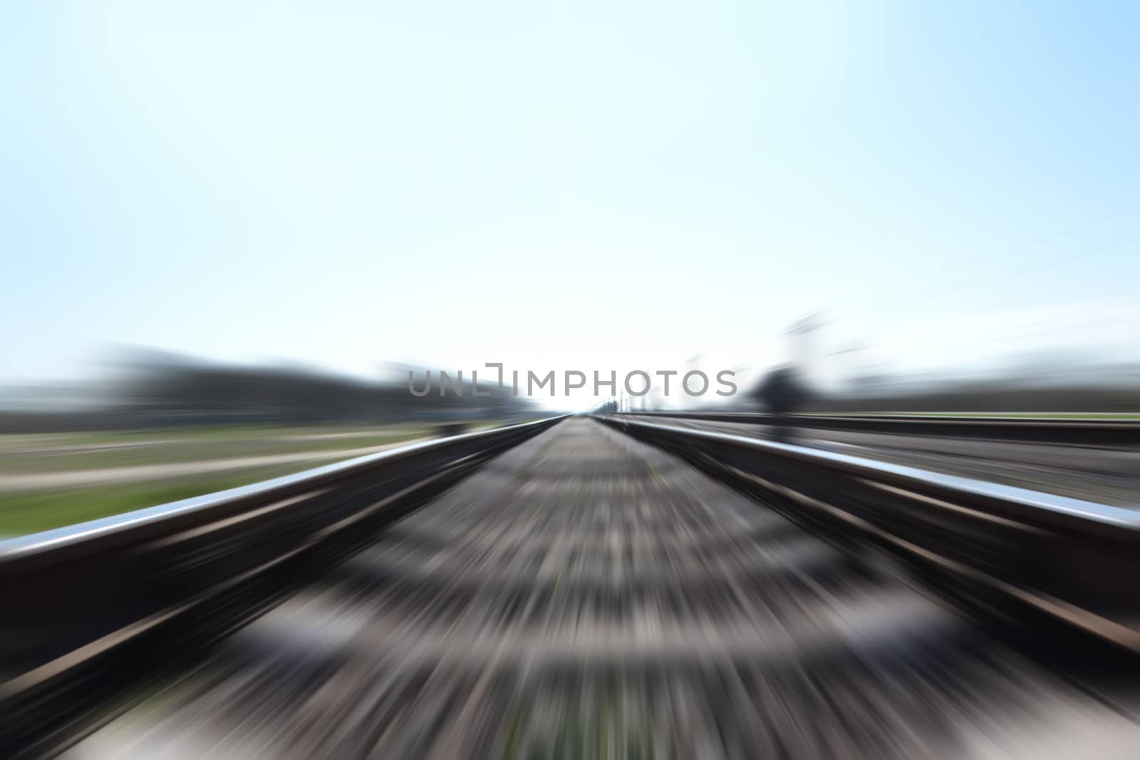Photo of a Fast train in motion and blue sky by Lexxizm
