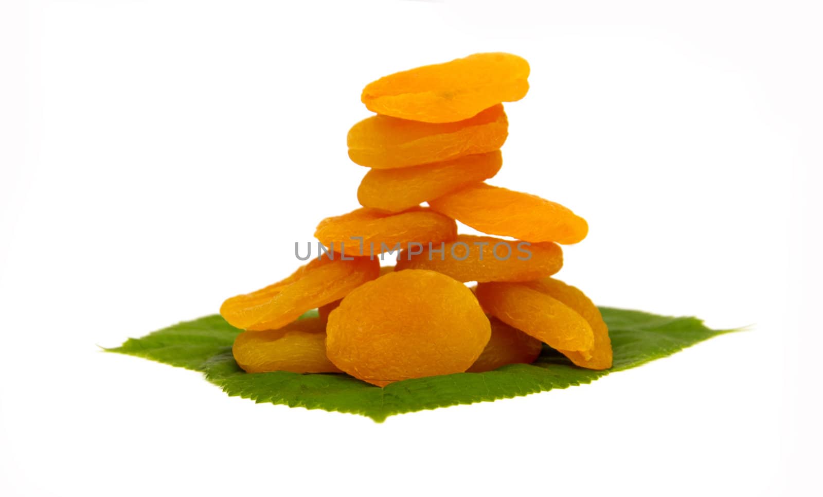 dried apricot with green leaves isolated on white background
