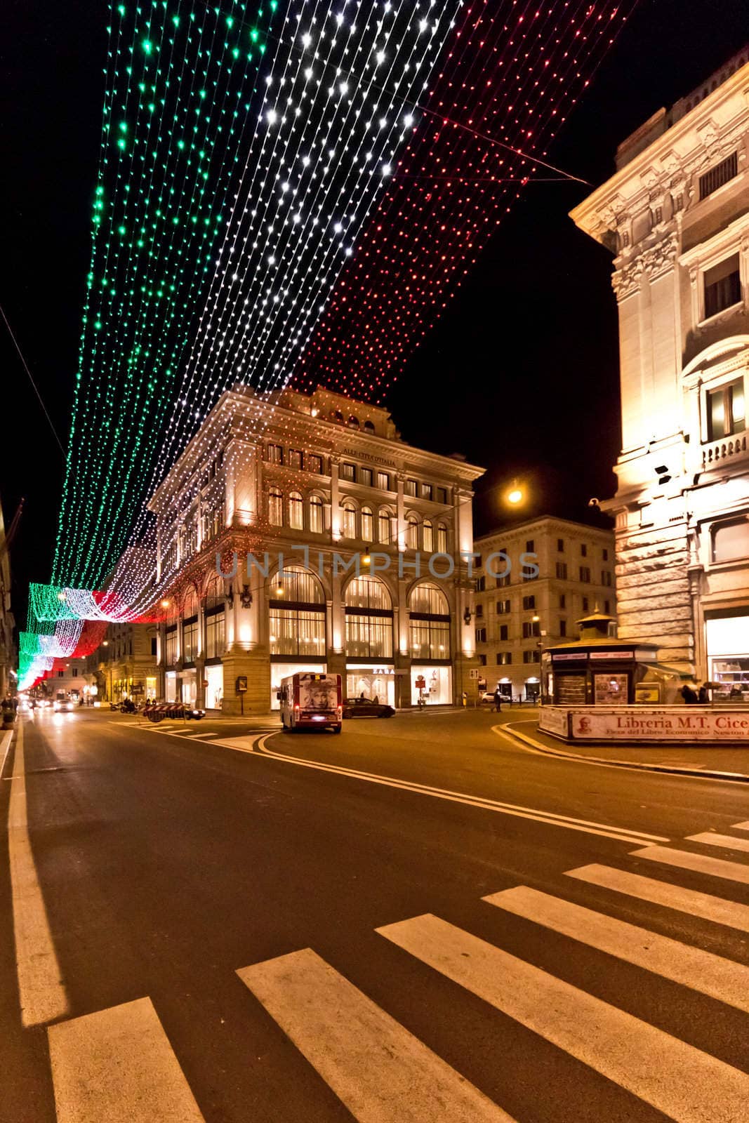 A very long string of christmas lights forming the Italian flag during Christmas in Rome