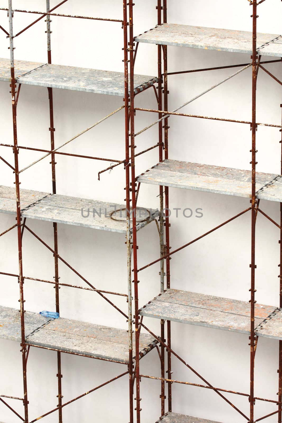 Rusty tubular scaffolding at a construction site 