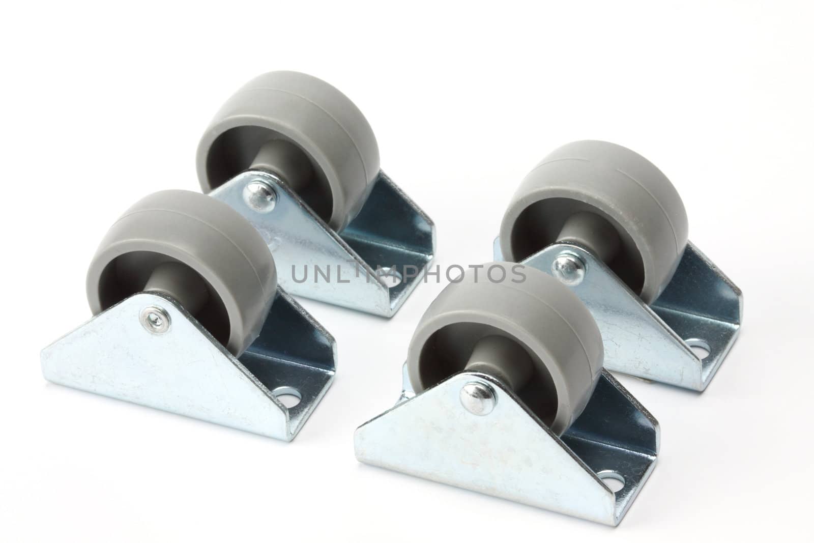 Furniture casters close up on white background 