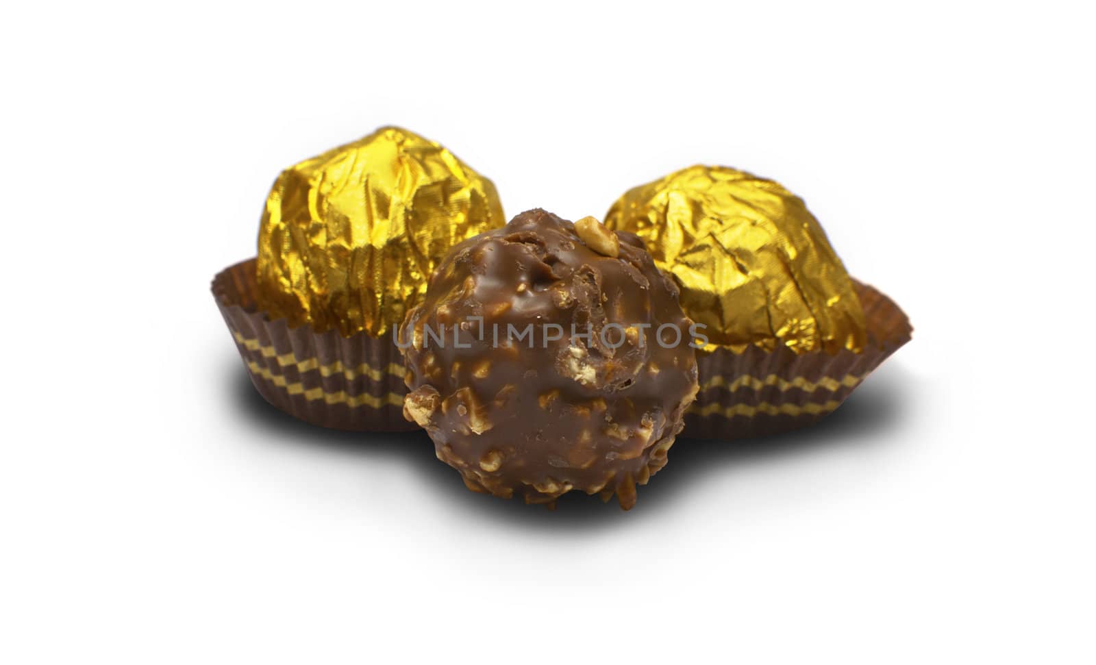 wrapped chocolates on white background