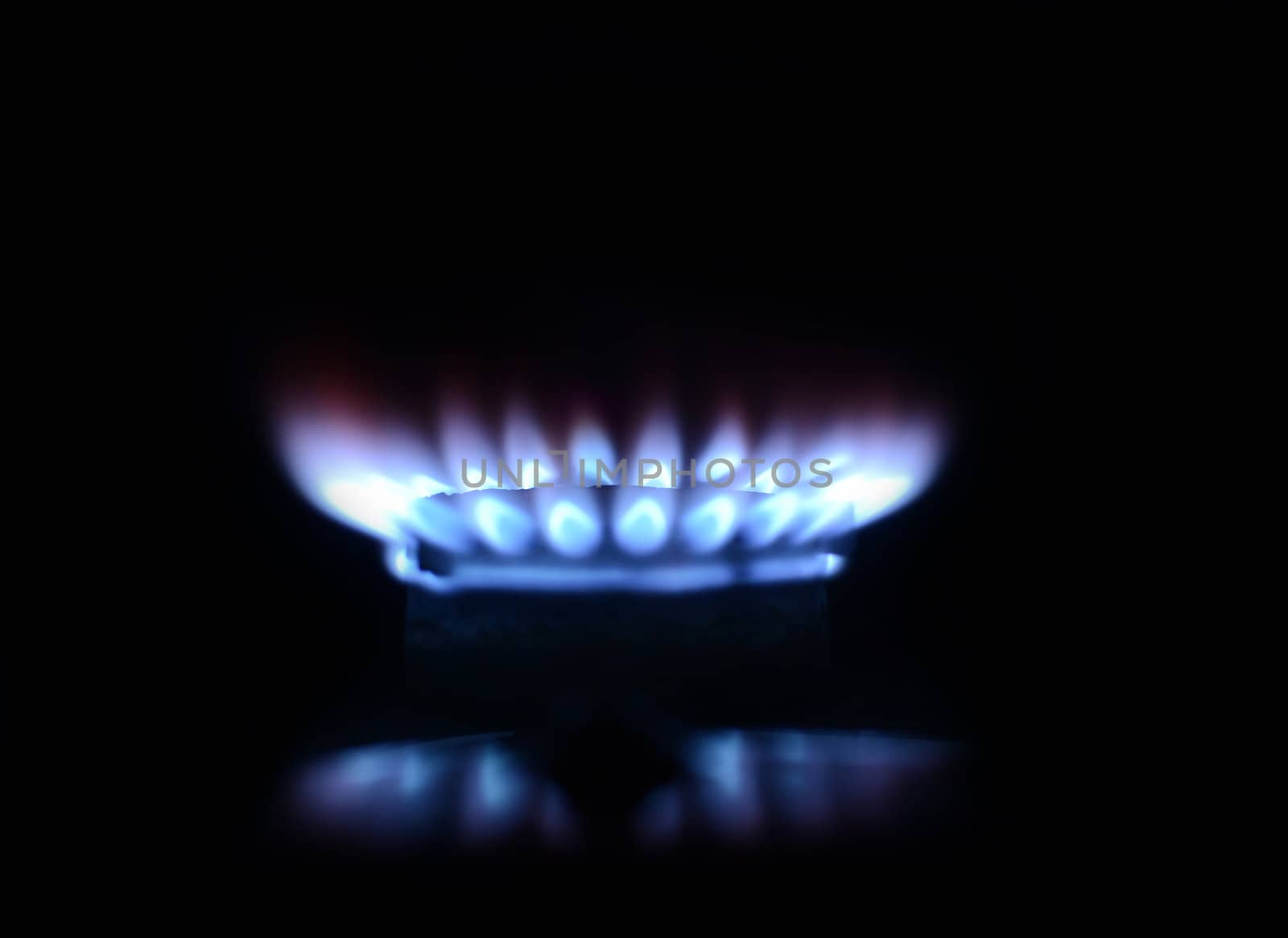 blue flame of gas on a black background