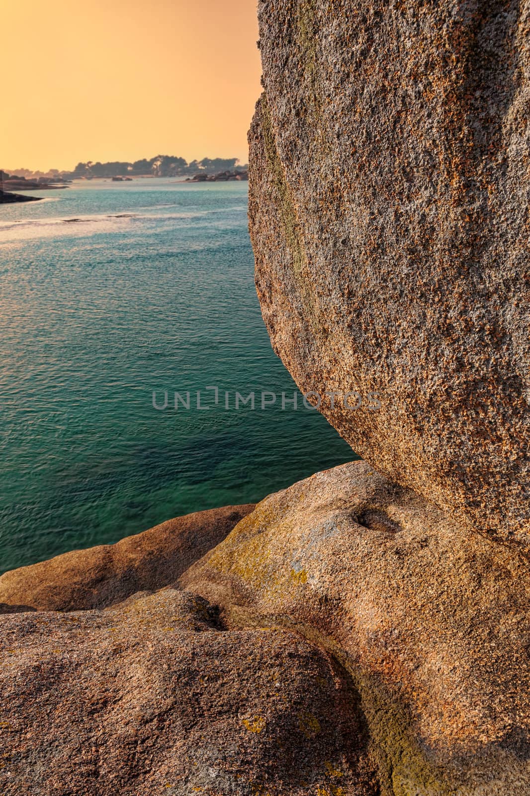 Detail of rocks at sunset located on the Pink Granite Coast in north-west of France.