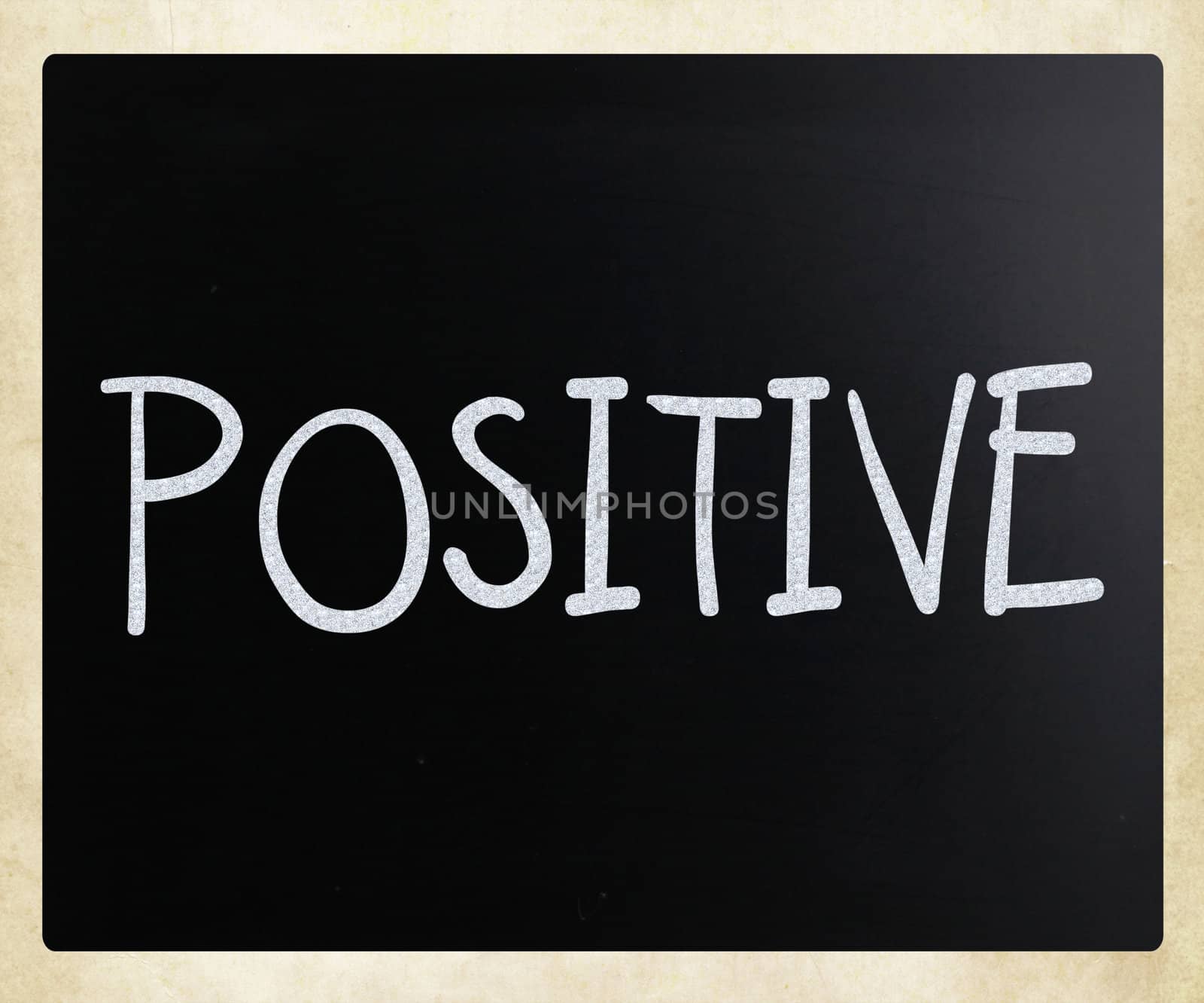 "Positive" handwritten with white chalk on a blackboard