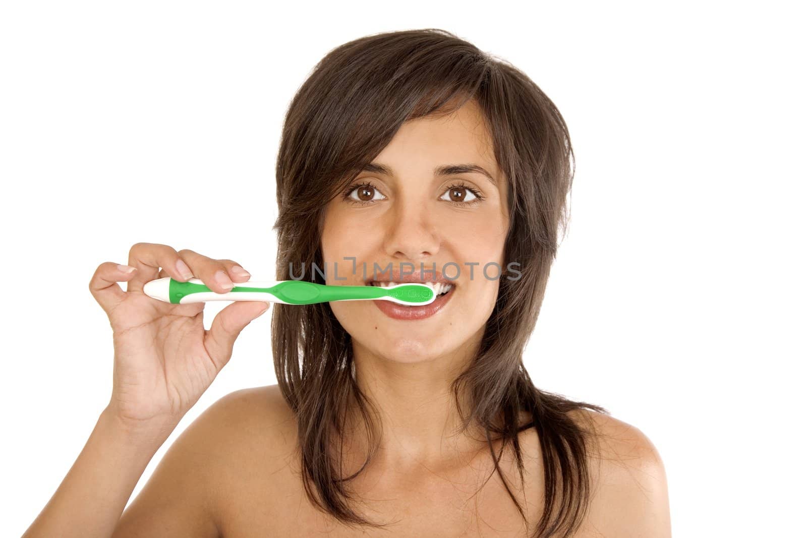 Young woman brushing her teeth by VictorO