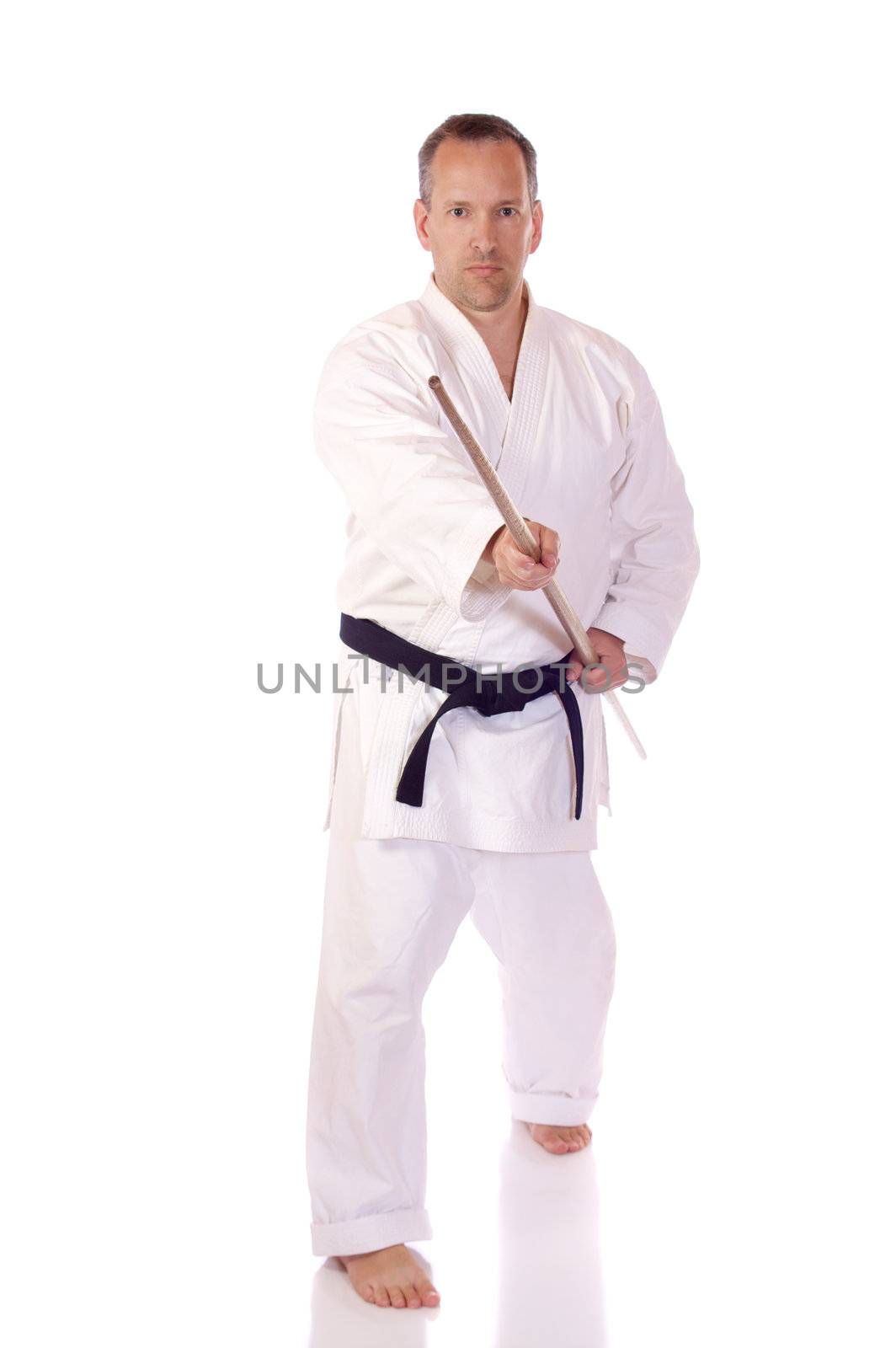 Man in karate-gi holding a bo staff