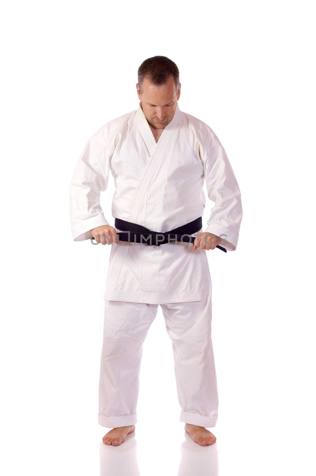 Karateka fastening his belt by Talanis