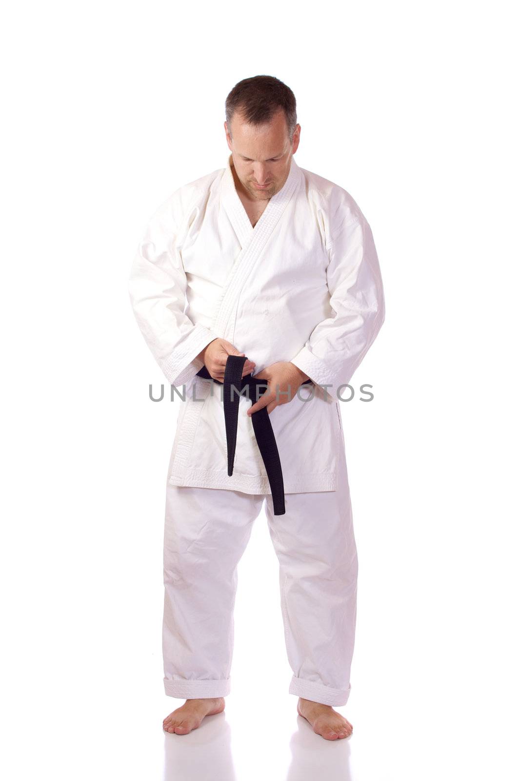 Karateka fastening his belt by Talanis