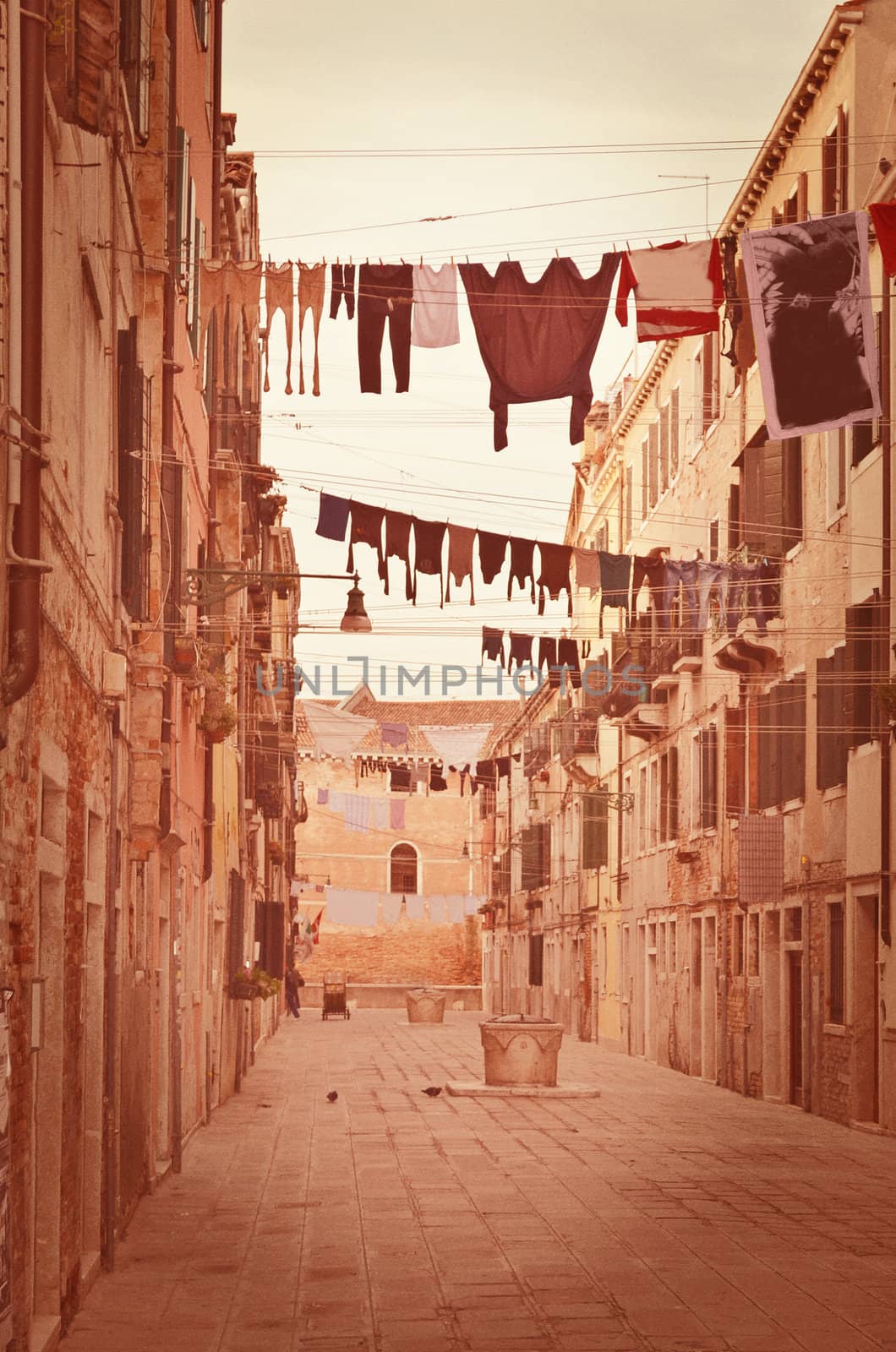 Old Venetian yard, Italy.Photo in old color image style. by Zhukow