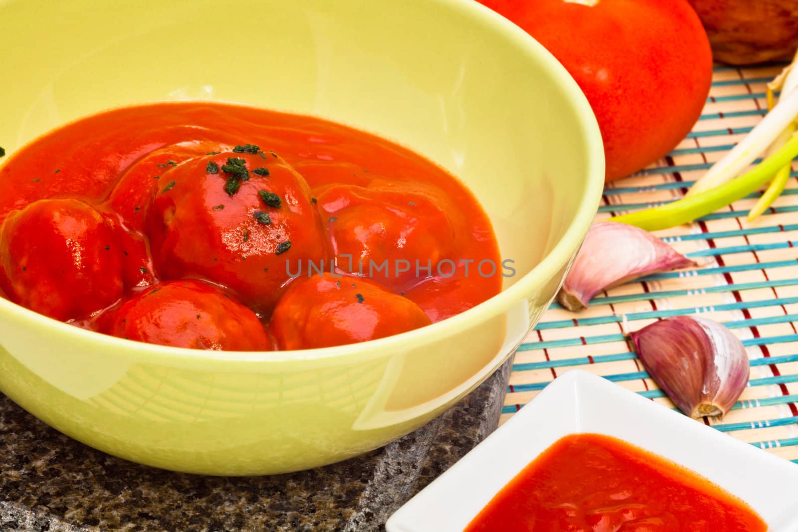 Bowl with meatballs and tomato sauce