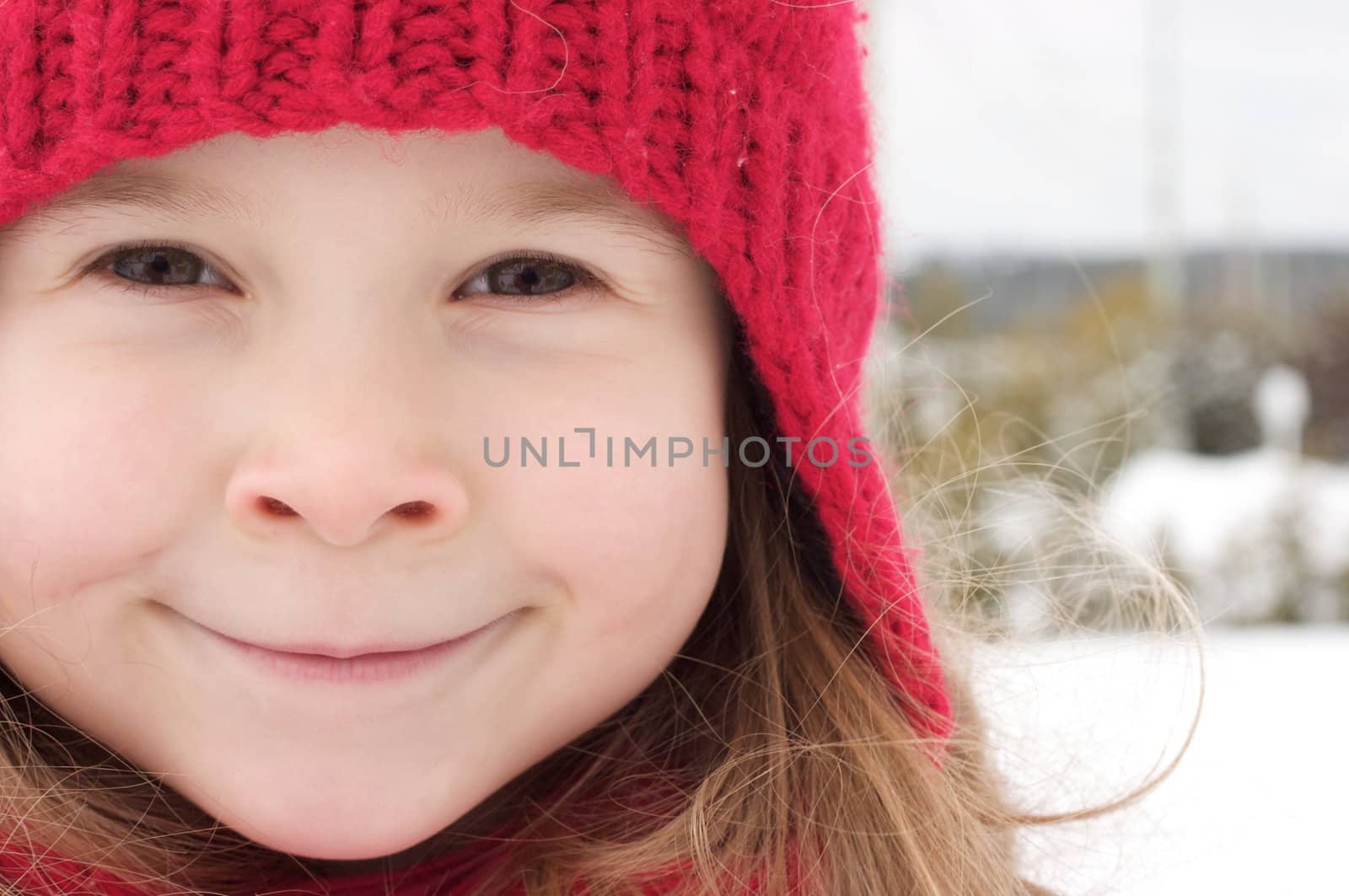Cute little girl playing in the snow