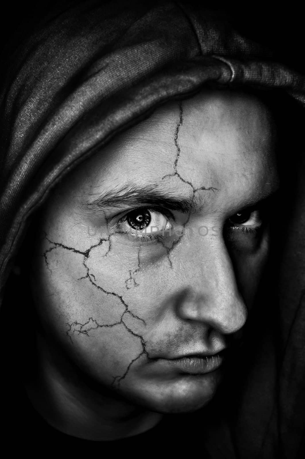 portrait of sinister,spooky looking man with cracked skin