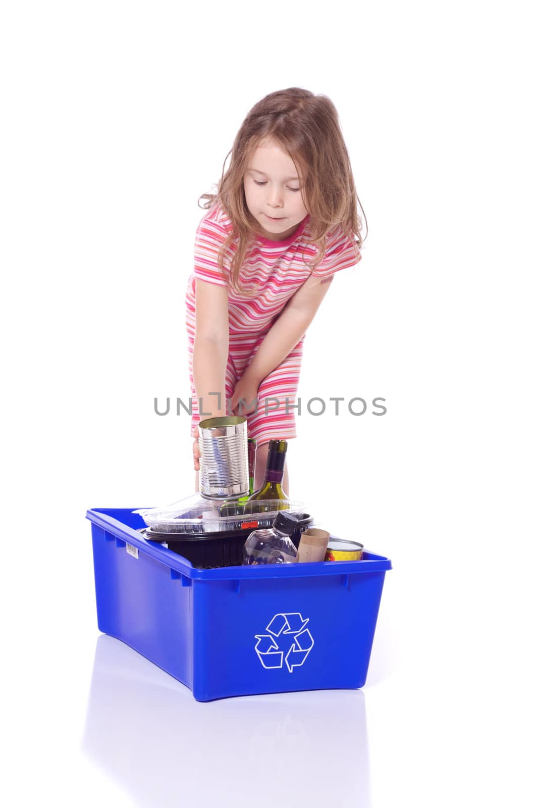 Cute little girl recycling a can