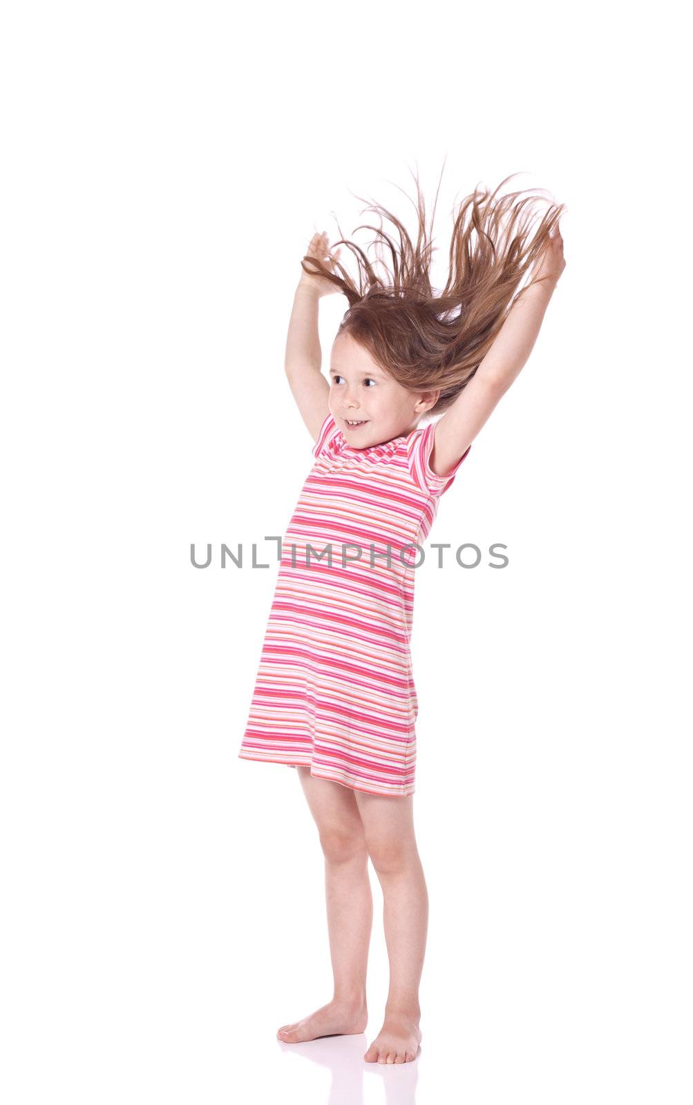 Cute little girl with wind in her hair