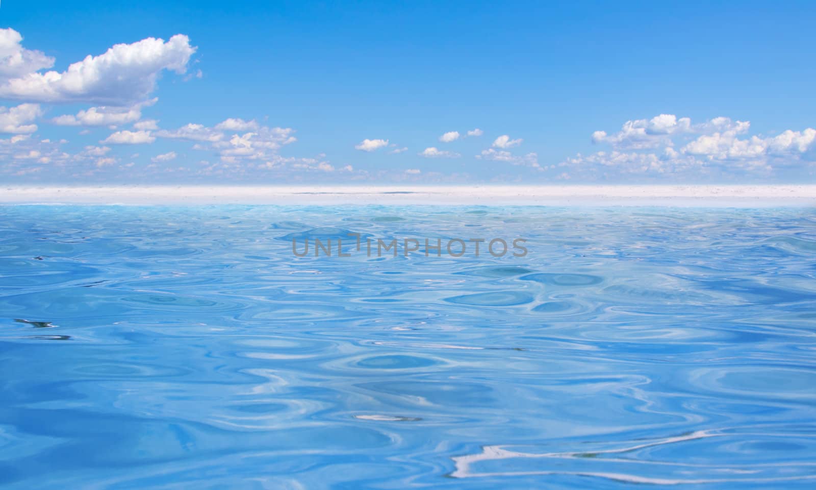 beautiful blue water and sky  by Lexxizm