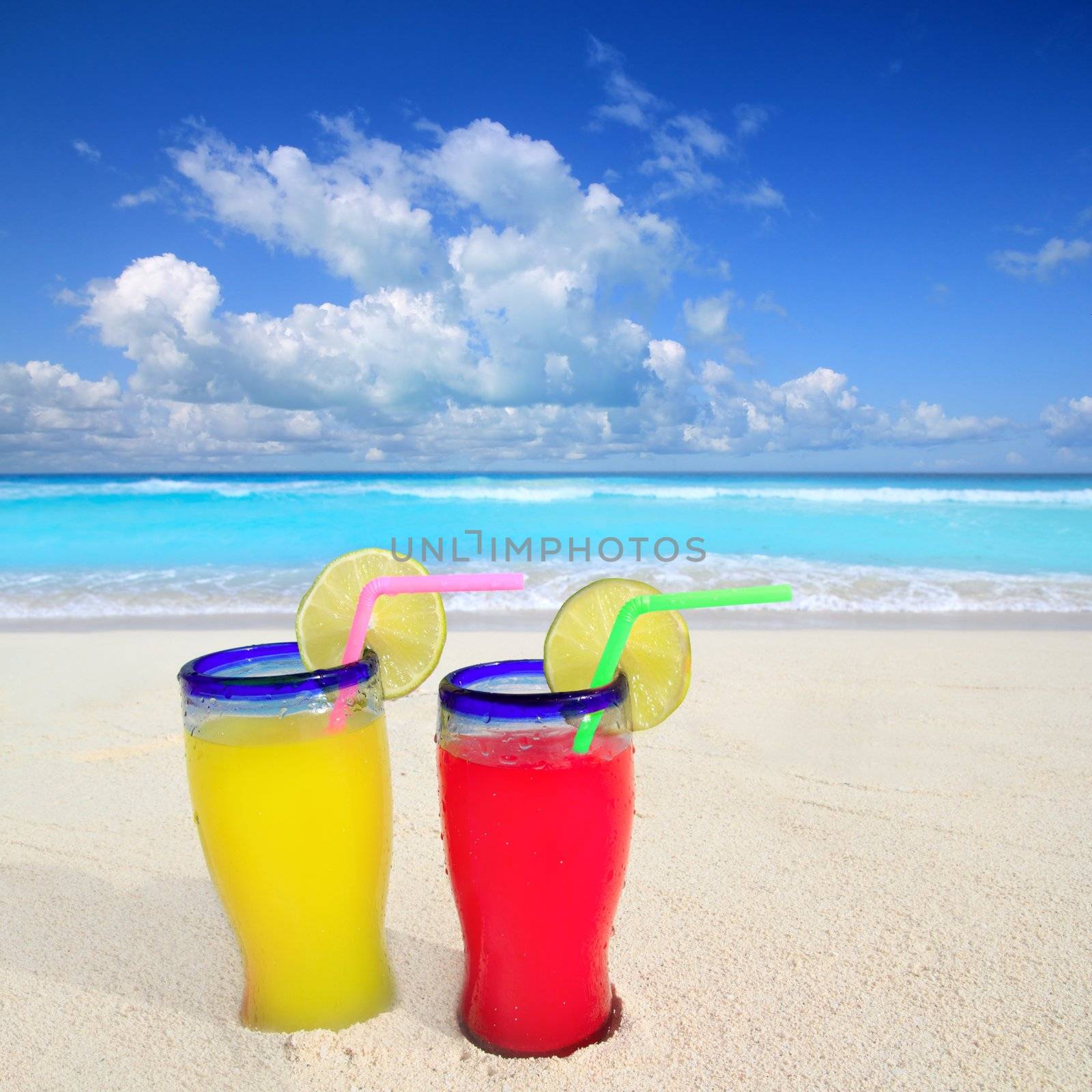 beach cocktails yellow red in caribbean tropical turquoise sea sand