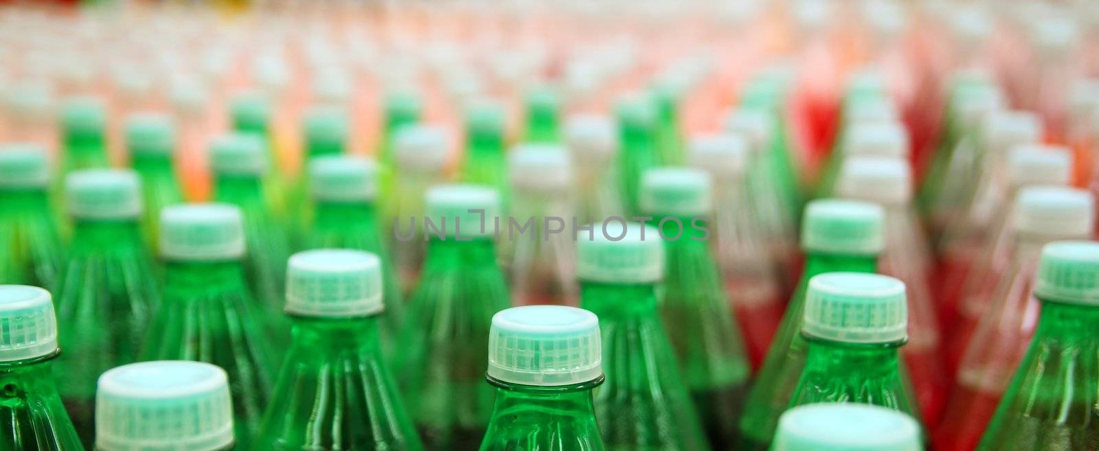 colorful juice beverage plastic bottle in factory line