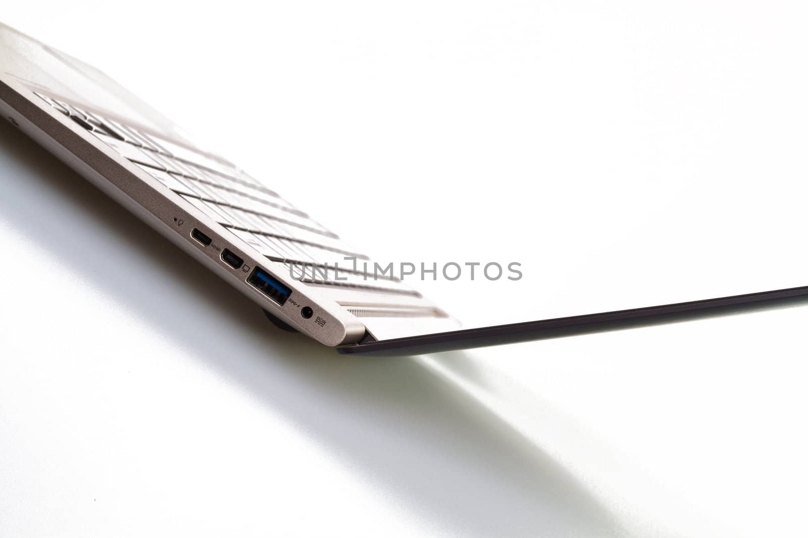 Angled view of an ultrathin modern laptop against white for abstract and background