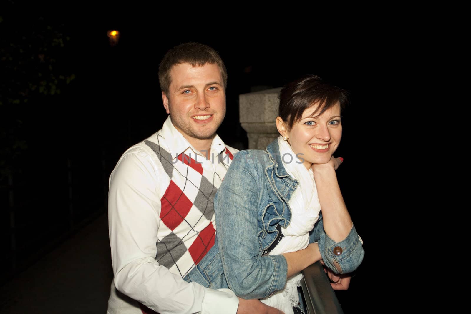 young couple on the streets of Prague nightlife by jannyjus