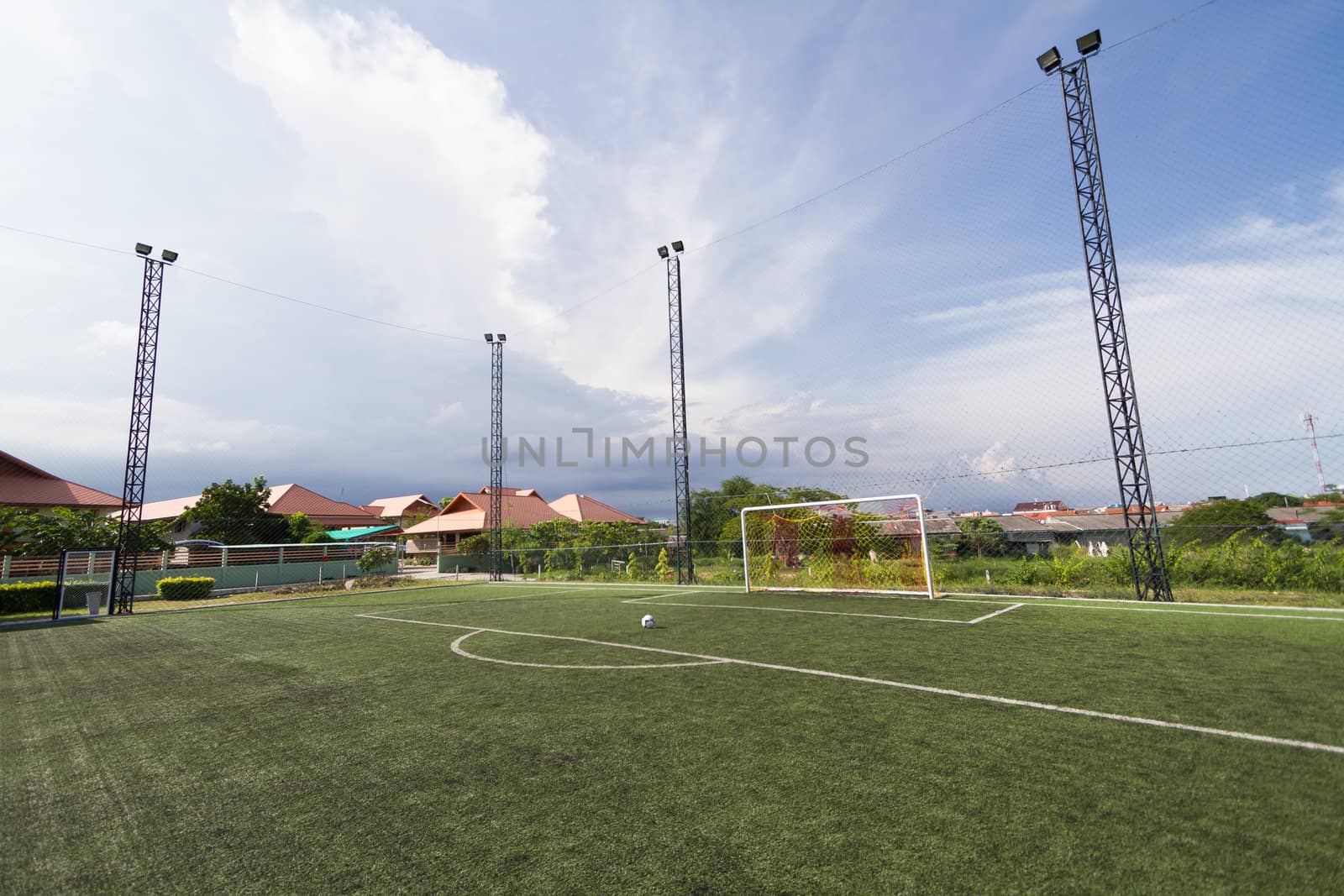 soccer football pitch with green artificial grass