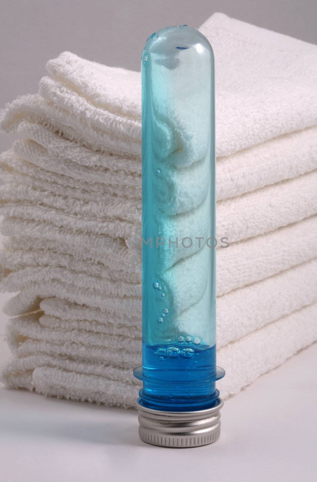White towels and two bottles with shampoo