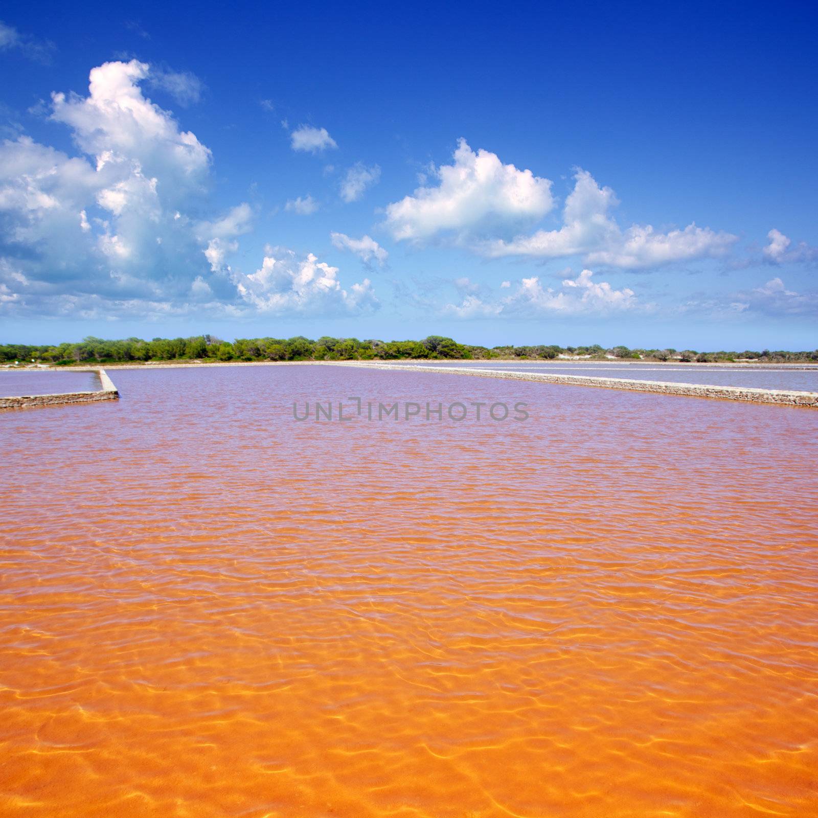 Formentera Ses Salines saltworks red orange water lakes with ripple waves