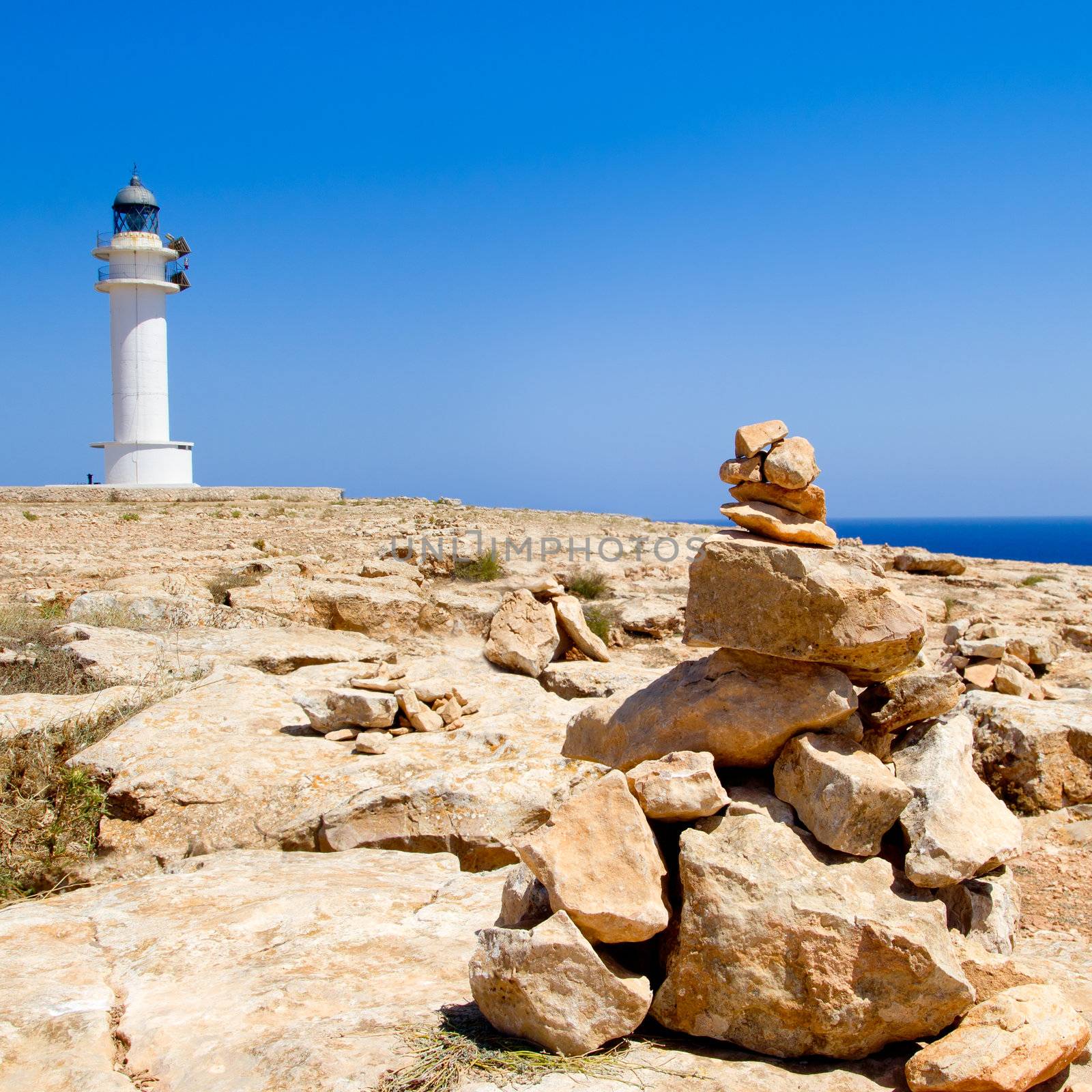 Barbaria formentera Lighthouse and make a wish stones mound