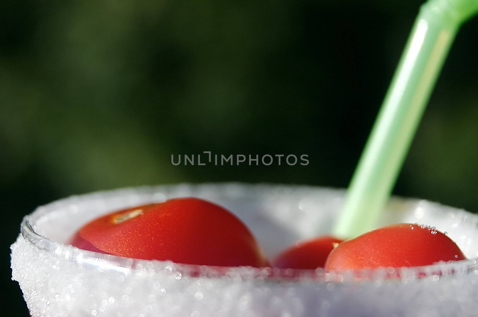 You thought you got a fresh tomato juice before? Can't beat this one. Small tomatoes in a glass filled with water and with a sugar coating with a straw.