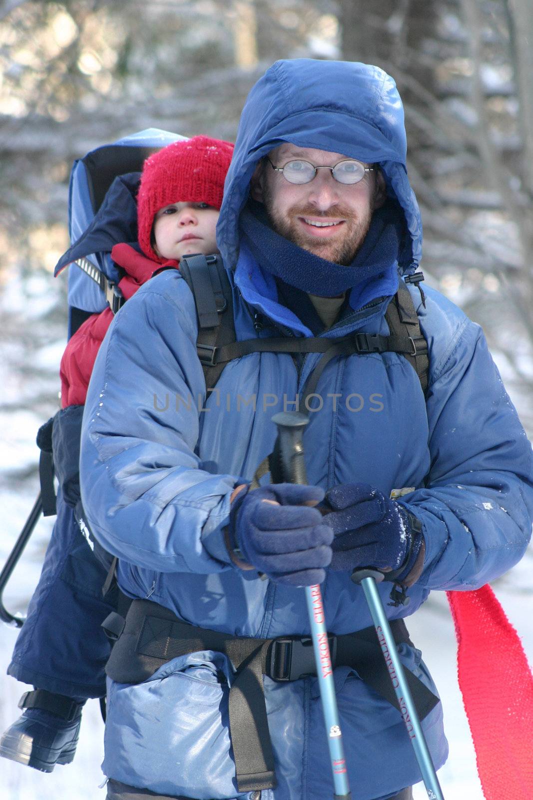 Father and daughter in a snow shoes hike